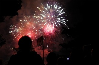 Mercer 19179 A small crowd watches fireworks.