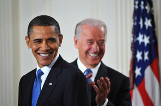 President Barack Obama smiles before signing the health insurance reform bill March 23, 2010 in the East Room of the White House.