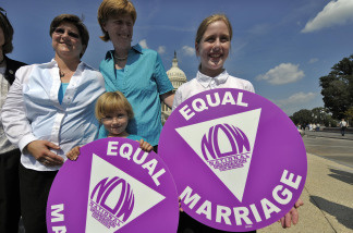 Jen and Dawn Barbouroske (L) and their daughters McKinley and Bre pose at a news conference with same-sex couples who asked to repeal the Defense of Marriage Act in Washington, DC, on September 15, 2009.