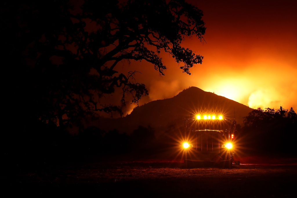 Multiple Wildfires Destroy Homes, Threaten California Wine Country A fuel truck sits in a staging area as the Nuns Fire burns in the hills of Kenwood, California on October 10, 2017.
