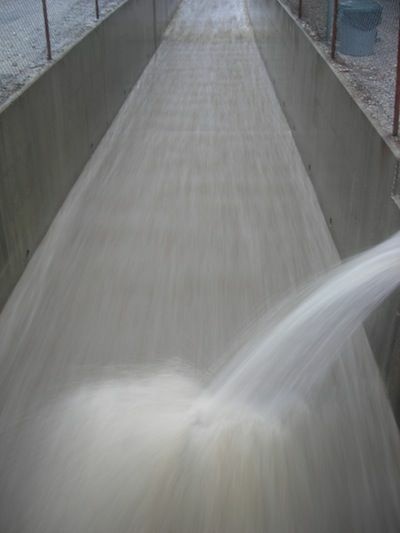 One of the best sights a flood maintenance engineer can see below a debris basin: a fast-flowing storm drain, indicating the bathtub is emptying.