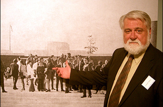 Mercer 7423 Former Norton Simon museum (nee Pasadena Art Museum) curator Fred Parker, in front of a photo of famous photographers gathered on the museum steps for a much earlier exhibit. Parker's not in the photo because he took it.