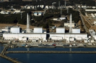 Mercer 15867 An aerial view shows the quake-damaged Fukushima nuclear power plant in the Japanese town of Futaba, Fukushima prefecture on March 12, 2011. The operator of Japan's tsunami-ravaged nuclear power plant said Wednesday that work was steadily progressing in its plans to remove fuel rods from a cooling pool at the center of international concerns.The Fukushima Dai-ichi nuclear power plant suffered meltdowns at three reactors as a result of the March 2011 earthquake and tsunami.