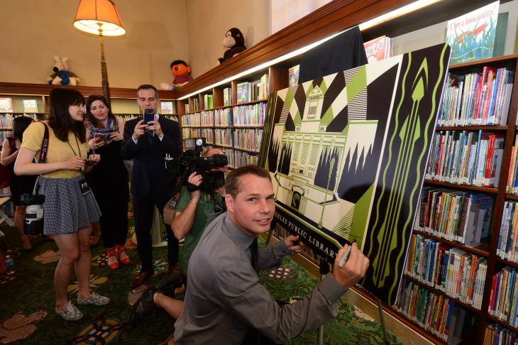 L.A. Mayor Eric Garcetti with artist Shepard Fairey at the unveiling of the city's first artist-designed library card. 
