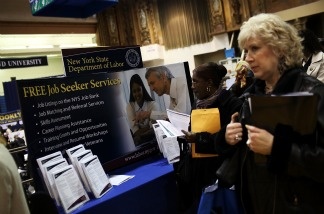 People looking for jobs wait in line to speak with potential employers at the Brooklyn Job Fair on April 13, 2011 in the Brooklyn borough of New York City.