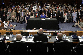 U.S. Supreme Court Justice nominee Elena Kagan gives her opening statement to the Senate Judiciary Committee Chairman on the first day of her confirmation hearings on Capitol Hill June 28, 2010 in Washington, DC.