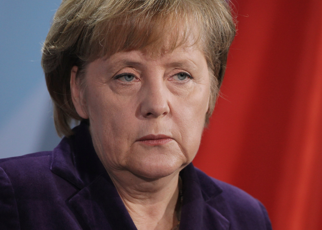 Merkel And Sarkozy Meet Over Euro BERLIN, GERMANY - JANUARY 09: German Chancellor Angela Merkel speaks to the media following talks with French President Nicolas Sarkozy at the Chancellery on January 9, 2012 in Berlin, Germany. The two leaders discussed the ongoing Eurozone debt crisis as well as a possible European financial transaction tax, among other topics. (Photo by Sean Gallup/Getty Images)