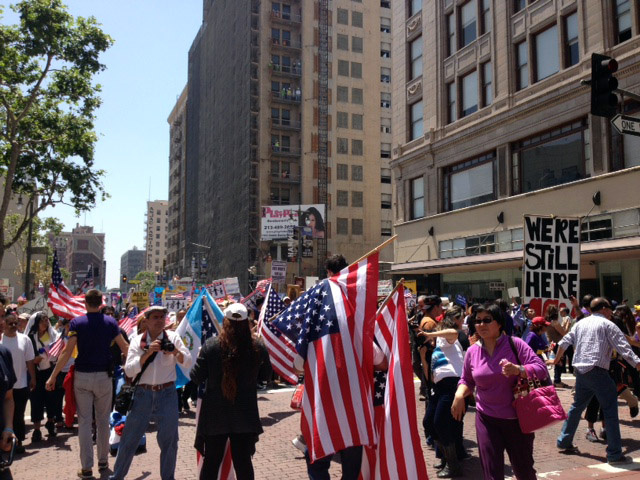 Immigrant advocates filed a lawsuit in Los Angeles Wednesday alleging that immigration agents are filing paperwork to keep arrestees in custody longer without investigating whether they're in the country illegally. (Photo: Immigration protesters take to the streets of Los Angeles for a May Day rally march, May 1, 2013.)