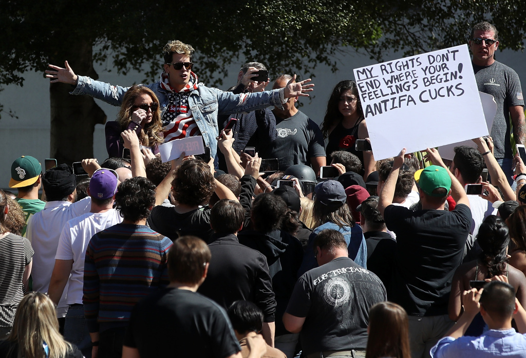 Right Wing Commentator Milo Yiannopoulos Gives Speech At Plaza In Berkeley BERKELEY, CA - SEPTEMBER 24: Right wing commentator Milo Yiannopoulos speaks during a free speech rally at U.C. Berkeley on September 24, 2017 in Berkeley, California. Hundreds of protesters came out to support and demonstrate against Milo Yiannopoulos as he held a free speech rally at U.C. Berkeley. (Photo by Justin Sullivan/Getty Images)