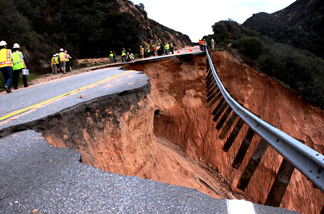 Caltrans and state emergency officials inspect a damaged section of Highway 330 near Highland on Thursday, Jan. 6, 2011. It could take up to two years to repair the storm-damaged roadway.