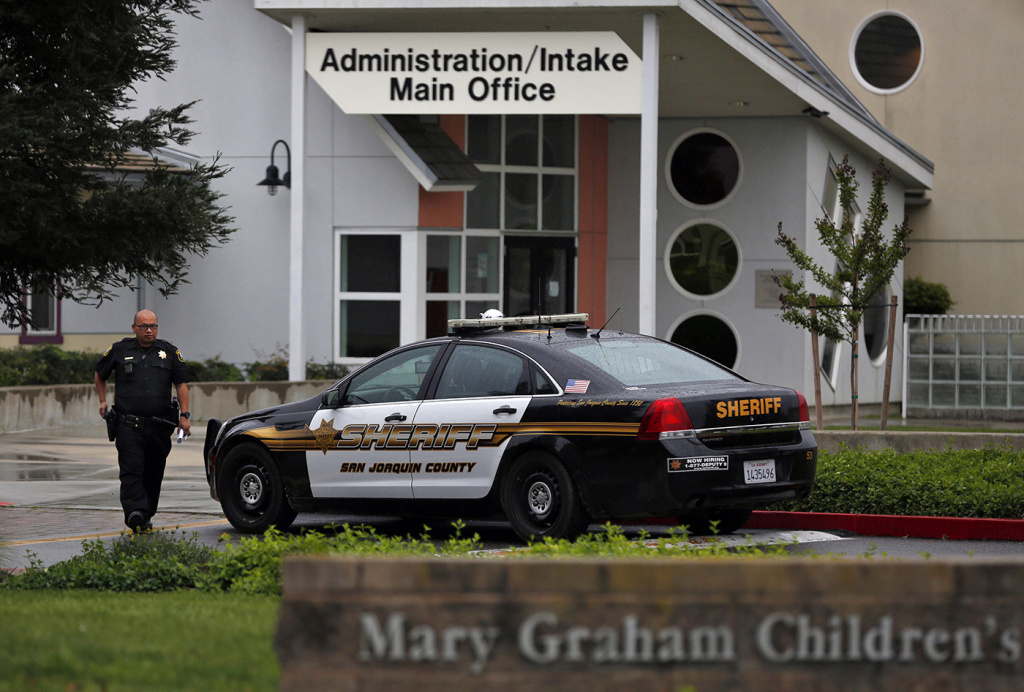 shelters_21 A San Joaquin County Sheriff's deputy walks back to his car after responding to a call to Mary Graham Children's Shelter April 6, 2017 in French Camp, Calif.