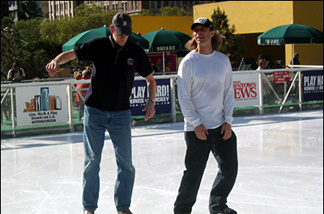 Mercer 7461 John Rabe (L) on the ice at Pershing Square with Clark Tufts, a former pro IHL player who manages the rink and coaches hockey.
