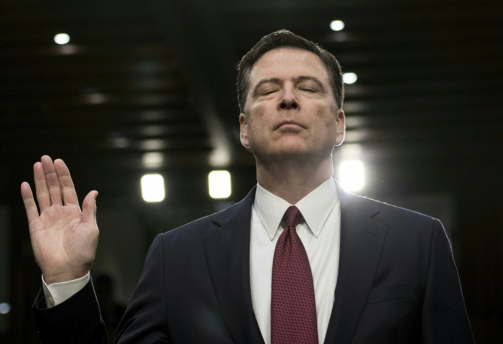 TOPSHOT-US-POLITICS-CONGRESS-INTELLIGENCE Former FBI director James Comey is sworn in during a hearing before the Senate Select Committee on Intelligence on Capitol Hill June 8, 2017 in Washington, DC.