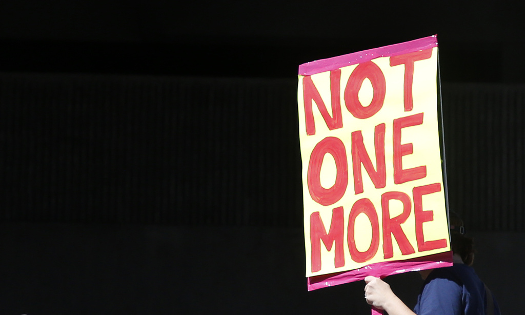 US-SCHOOL-SHOOTING-PROTEST Protesters hold signs at a rally for gun control at the Broward County Federal Courthouse in Fort Lauderdale, Florida on February 17, 2018.