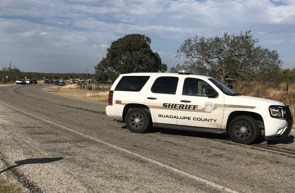 US-CRIME-SHOOTING Police block a road in Sutherland Springs, Texas on November 5, 2017, after a mass shooting a church nearby.