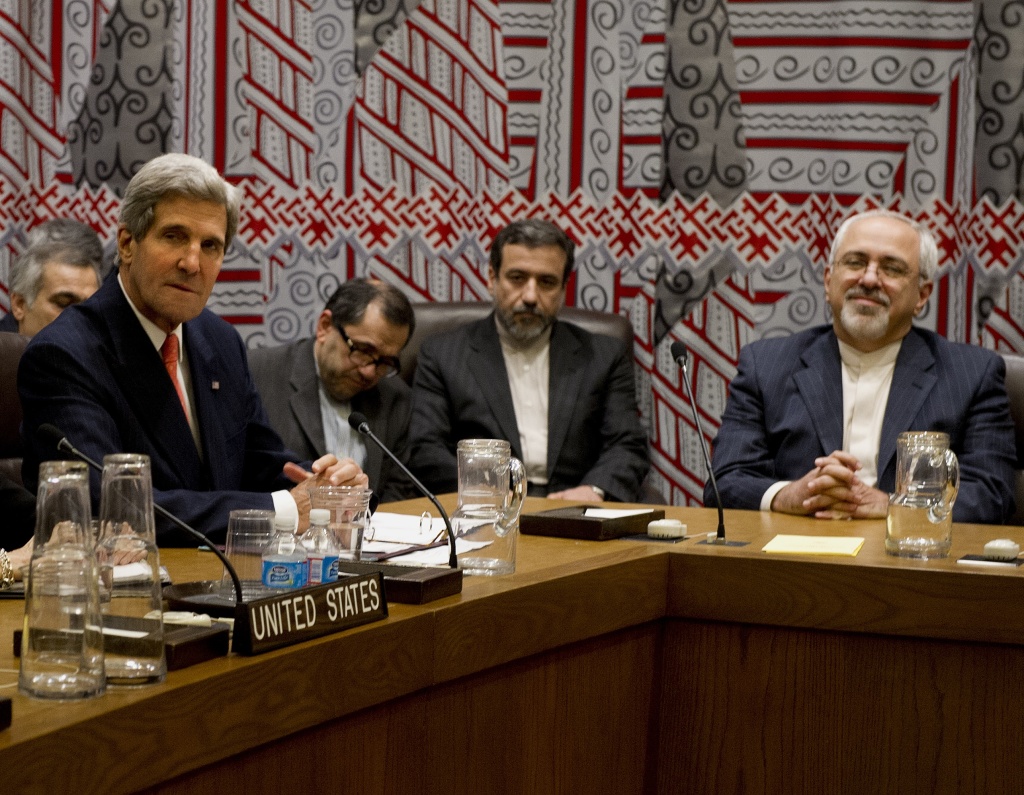 US Secretary of State John Kerry (L) and Iran's Foreign Minister Mohammad-Javad Zarif (R) attend a meeting of the five permanent members of the United Nations Security Council plus Germany about Iran's nuclear program September 26, 2013 on the sidelines of the General Assembly at UN headquarters in New York.