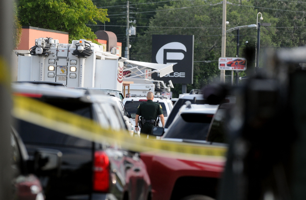 At Least 20 Dead In Mass Shooting At Orlando Gay Nightclub ORLANDO, FL - JUNE 12: Orlando police officers seen outside of Pulse nightclub after a fatal shooting and hostage situation on June 12, 2016 in Orlando, Florida. The suspect was shot and killed by police after 20 people died and 42 were injured. (Photo by Gerardo Mora/Getty Images)