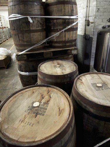 Used bourbon barrels like these at the Goose Island Brewery in Chicago are finding new life by bringing distinctive flavor to beer, cocktails and hot sauce.