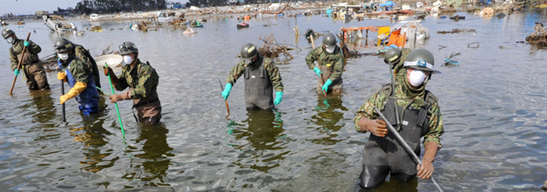 In Sendai, which is outside the evacuation zone around the crippled Fukushima nuclear power plant, members of the Japanese Self-Defence Force searched for bodies today (March 28, 2011).