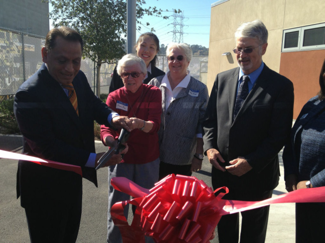 The late astronaut Sally Ride's mother Joyce Ride and her sister Bear Ride help with the ribbon-cutting on The Sally Ride Center for Environmental Science at L.A. Unified. Democratic Assemblyman Gil Cedillo of Los Angeles helps hold the scissors. School board member Bennett Kayser looks on.