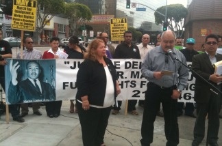 Immigrants’ and workers’ rights advocates announce plans for a May 1 march during a small rally in downtown Los Angeles on April 13, 2011.