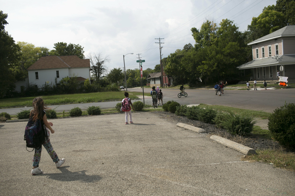 Kids walk home from school in Springfield. The city's population has fallen over the years. Now many young people go to college and leave the city. Kids walk home from school in Springfield. The city's population has fallen over the years. Now many young people go to college and leave the city.