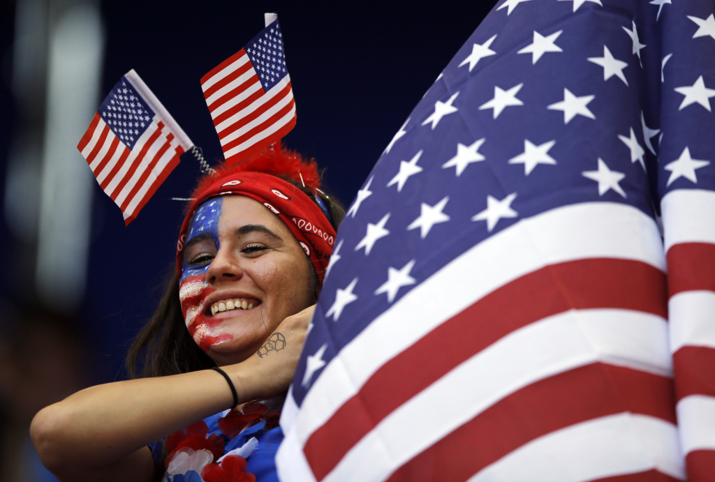 WWCup Fox's Investment Soccer FILE - In this May 30, 2015, file photo, a spectator watches warm-ups before an international friendly soccer match between South Korea and the United States in Harrison, N.J. In broadcasting the Women's World Cup, Fox executives are thrilled for the chance to potentially see the favored U.S. team make a run to the title. But what can really draw in viewers is the realization that the Americans could lose. (AP Photo/Julio Cortez, File)