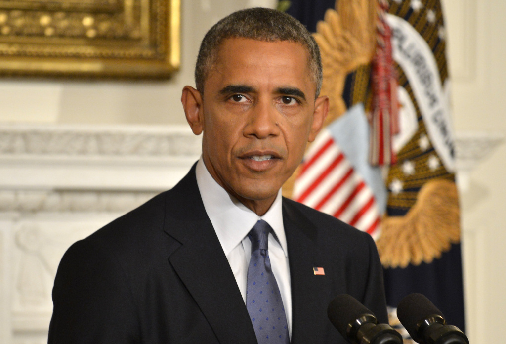 President Obama Delivers Statement On Humanitarian Crisis In Iraq WASHINGTON, DC - AUGUST 7: U.S. President Barack Obama addresses the nation from the State Dining Room of the White House on August 7, 2014 in Washington, DC. Obama announced he has authorized military strikes against the Islamic State of Iraq and the Levant (ISIS) and a humanitarian aid drop. ISIS has been advancing on the important city of Erbil, Iraq and a civilian humanitarian crisis has developed. (Photo by Mike Theiler-Pool/Getty Images)