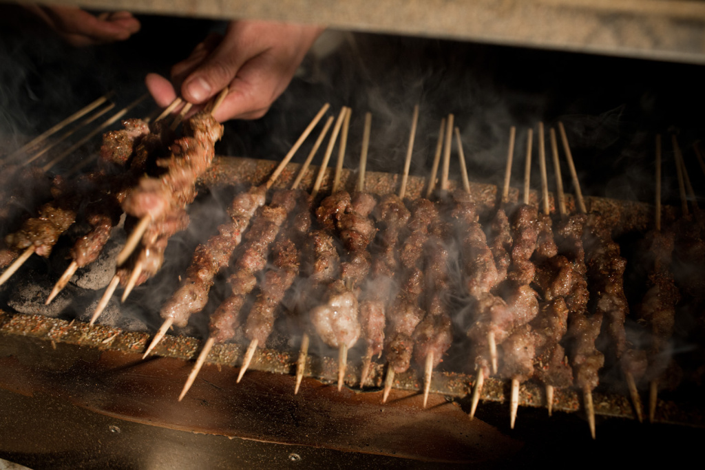 Night Market The Kebab Brothers prepare lamb kebabs with cumin and charcoal.