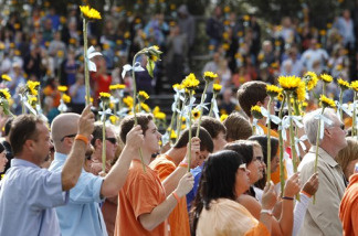 People attend a memorial service held at Poway High School for teenager Chelsea King Saturday March 13, 2010, in Poway, Calif. Thousands of people attended the memorial for the 17-year-old girl whose murder has shaken her community and spurred calls for legal changes in how child sex offenders are treated.