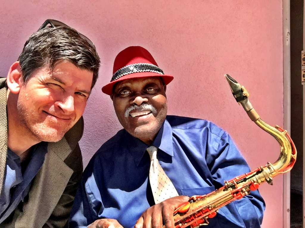 Off-Ramp host John Rabe with 90-year old sax legend Big Jay McNeely outside McNeely's home in South LA. Off-Ramp host John Rabe with 90-year old sax legend Big Jay McNeely outside McNeely's home in South LA.