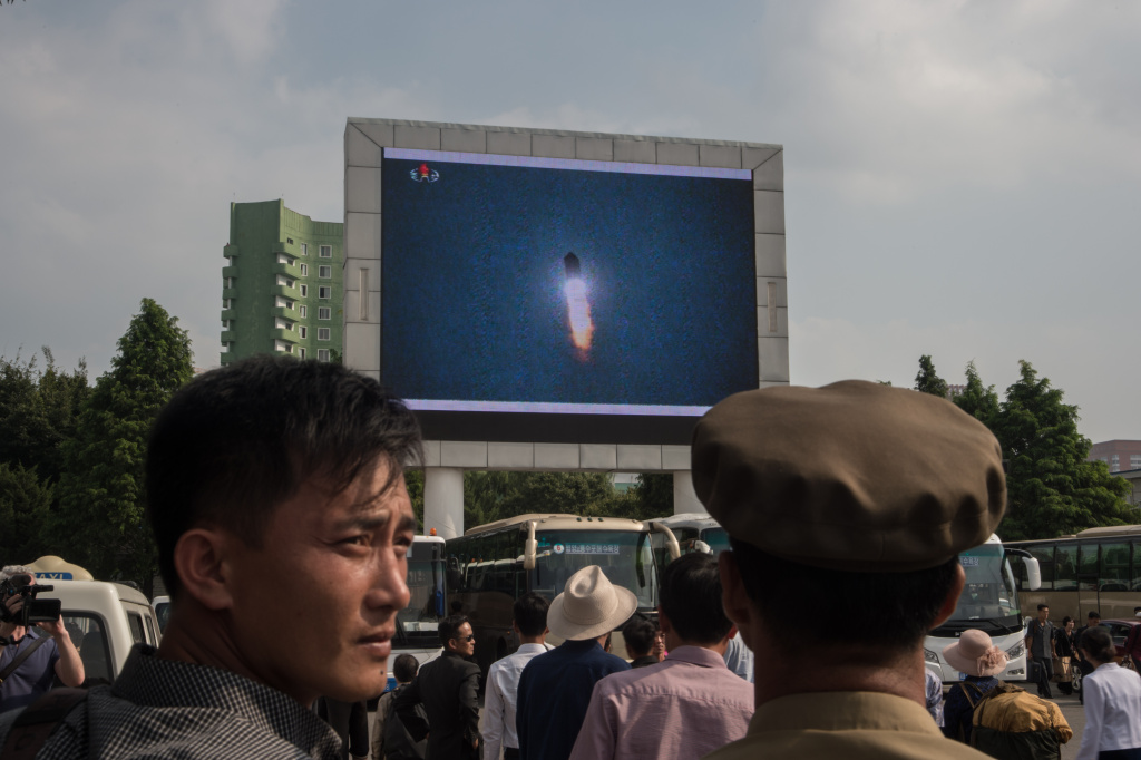MISSILE-NKOREA-SKOREA-JAPAN-US-DIPLOMACY A screen shows news coverage of an August 29 missile test launch in a public square outside a train station in Pyongyang, North Korea on August 30, 2017.