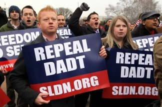 Mercer 12896 Activists hold signs as they shout slogans during a rally on 'Don't Ask, Don't Tell' on Capitol Hill in Washington, D.C., on Dec. 10, 2010. Servicemembers Legal Defense Network held the rally to call on the Senate to pass the National Defense Authorization Bill that includes the repeal of 'Don't Ask, Don't Tell' which prohibits gay people from serving openly in the military. The House voted 250 to 175 on Dec. 15 2010 to repeal the DADT policy.