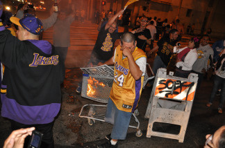 Laker fans start a small fire in the middle of the intersection at Hope St. and 9th St. in Downtown Los Angeles following the Lakers NBA Championship victory over the Boston Celtics on June 17, 2010.