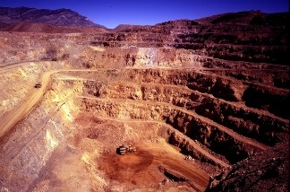 The open pit mine at Molycorp Minerals' rare earths mining and processing facility in Mountain Pass, Calif. The mine is expected to produce 40,000 tons of rare earth minerals each year after a $500 million expansion project.