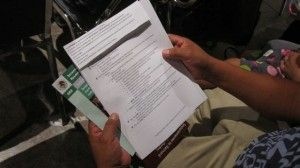 A man holds a list of guidelines during a workshop on deferred action at the Mexican consulate in Los Angeles, Aug. 14, 2012