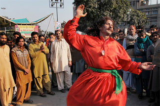 A Pakistani Sufi Muslim dances outside the Data Darbar, shrine to the patron saint of Lahore, during a three-day annual religious festival in Lahore, Feb. 4, 2010. Gatherings at the shrine have been curtailed since July, when suicide bombers killed more than 40 worshippers there.