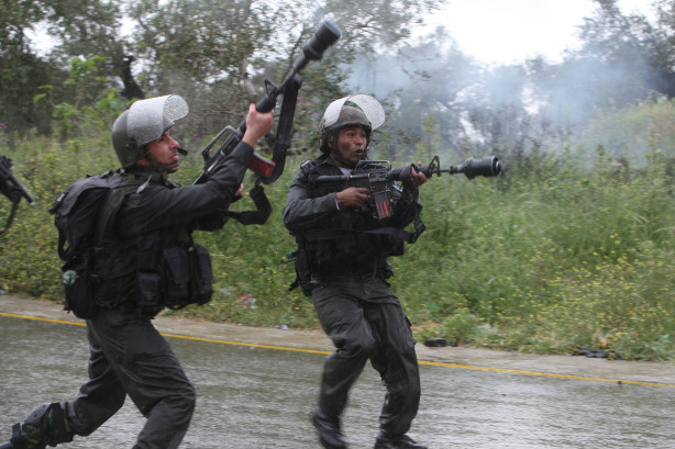 Israeli soldiers clash with Palestinians in the West Bank village of Nabi Saleh near Ramallah, following a protest against the expansion of the nearby Israeli settlement of Halamish on March 26, 2010. Israel vowed policy on Jerusalem would not change as Prime Minister Benjamin Netanyahu convened his security cabinet to craft a response to US demands for peace-promoting concessions.