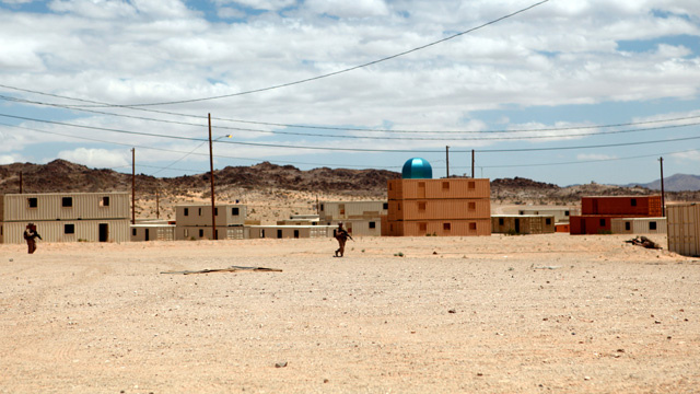 Marines conduct a patrol through the military operations in urban terrain facility at the Marine Corps Base 29 Palms, CA, on May 30, 2011. Marines conduct a patrol through the military operations in urban terrain facility at the Marine Corps Base 29 Palms, CA, on May 30, 2011.