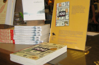 IOU, one of the books published by the Concord Free Press, is on display at The Concord Bookshop in Concord, Mass. As part of the publisher's generosity-based publishing model, patrons can take the book for free, but they're asked to make a donation to charity.