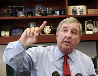 Los Angeles County District Attorney Steve Cooley announces his office will prosecute dispensaries that sell medical marijuana even if the Los Angeles City Council adopts an ordinance that does not ban such sales, during a news conference at his office in Los Angeles on Tueday, Nov. 17, 2009.