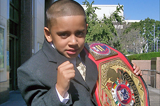 Mercer 7471 Mighty Mo puts up his dukes with his championship belt.