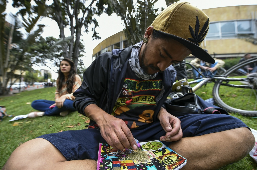 COLOMBIA-MARIJUANA-PROTEST An activist in Bogota, Colombia rolls a joint under the motto