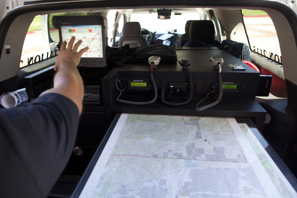 GIS TECH 003 Rancho Cucamonga Fire Department Battalion Chief Ivan Rojer demonstrates the capabilities of their geographic information system to track first responders and organize resources. The days of drawing out a response plan on a map are over, Rojer said.