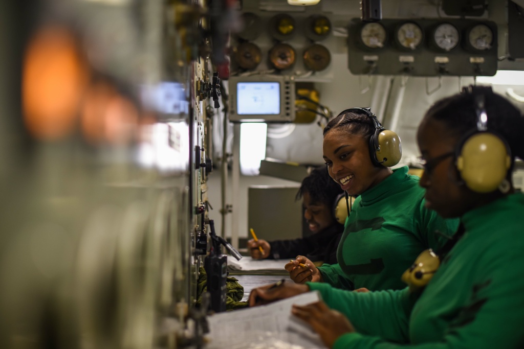 USS Theodore Roosevelt sailors communications ARABIAN GULF (Feb. 28, 2018) Aviation Boatswain’s Mate (Equipment) Airman Shamarie Martin monitors catapult systems aboard the aircraft carrier USS Theodore Roosevelt (CVN 71). The ship and its carrier strike group are deployed to the U.S. 5th Fleet area of operations in support of maritime security operations.