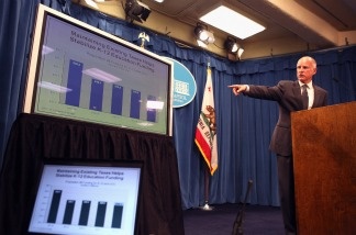 Gov. Jerry Brown points to a chart as he speaks to reporters during the announcement of his proposed budget at the California State Capitol on Jan. 10, 2011 in Sacramento.