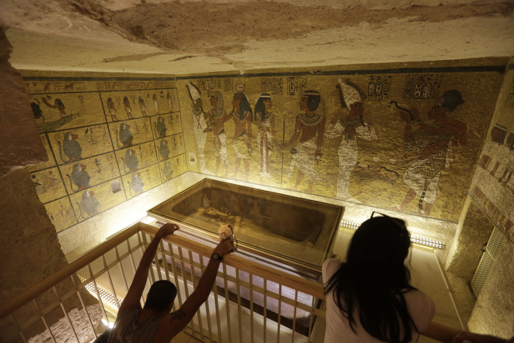 King Tut Exhibit In this Thursday, Nov. 5, 2015, file photo, tourists look at the tomb of King Tut as it is displayed in a glass case at the Valley of the Kings in Luxor.
