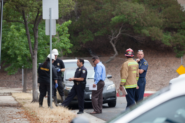 A student waits on the periphery of the Santa Monica College campus on Friday afternoon.