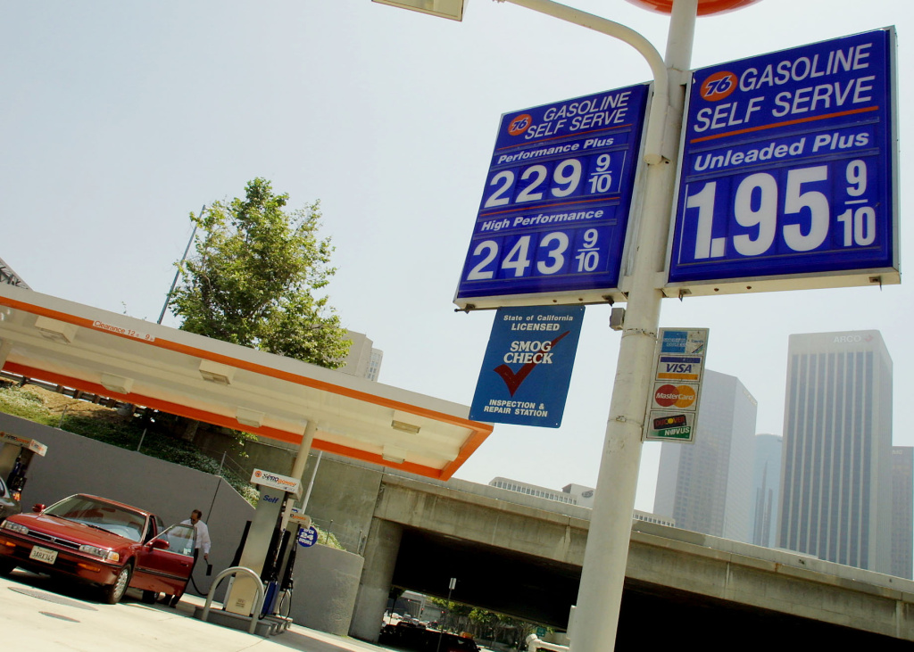 A motorists pumps gas 09 May 2001 at a downtown Lo A motorists pumps gas 09 May 2001 at a downtown Los Angeles gas station where self-service prices for a gallon of gasoline range from $1.95 to $2.43.