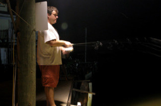 Bryan Casey does a bit of night fishing in an undisclosed location near Grand Isle, La.
